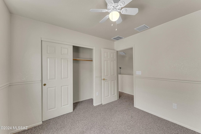 unfurnished bedroom with a closet, ceiling fan, and carpet