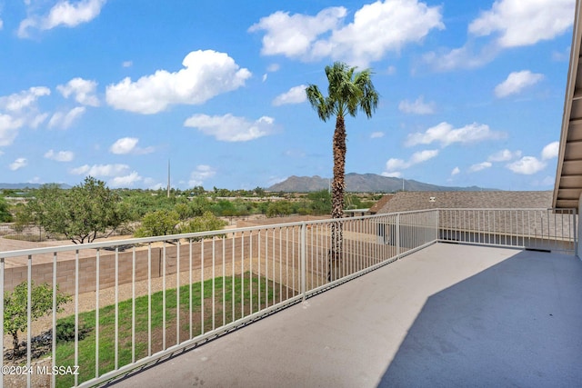 view of patio / terrace featuring a balcony and a mountain view