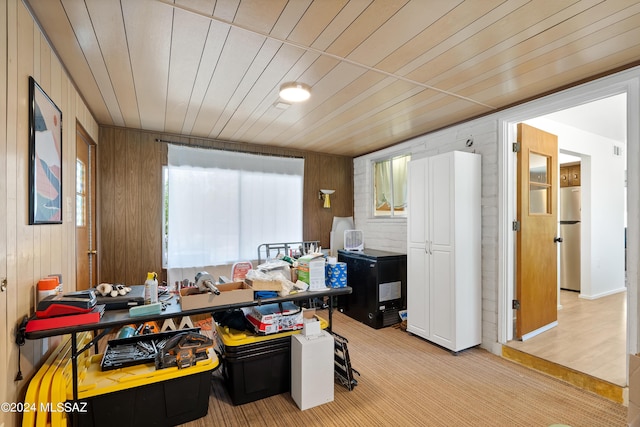 office area featuring wood walls and wood ceiling