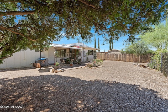 rear view of house featuring a patio