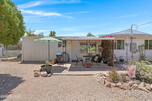 back of property featuring a patio