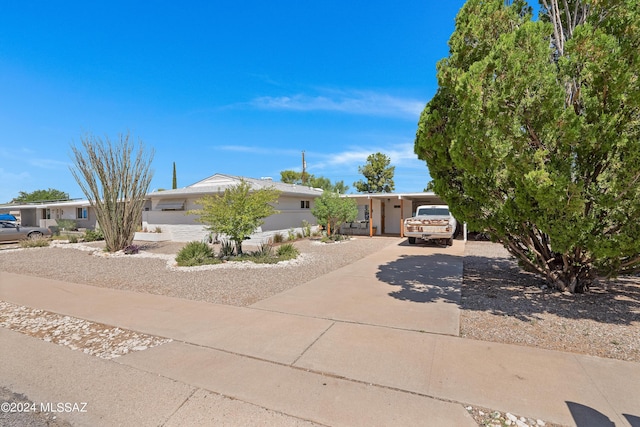 view of front of property featuring a carport