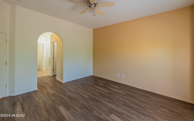 unfurnished room featuring dark hardwood / wood-style floors and ceiling fan