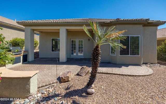 rear view of house featuring a patio