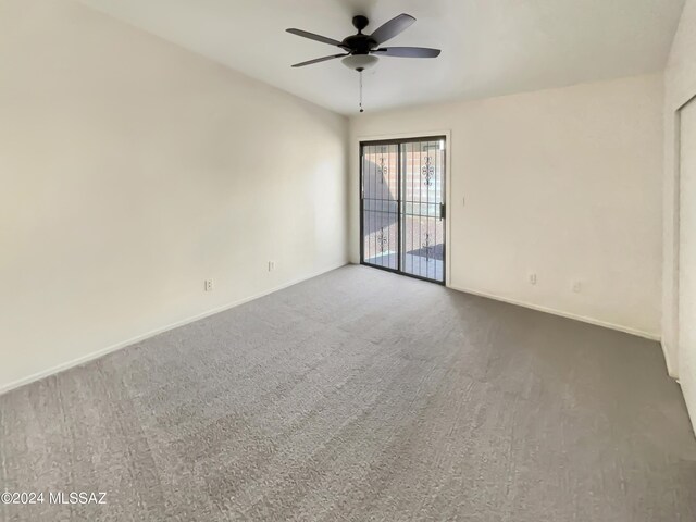 empty room with carpet flooring and ceiling fan