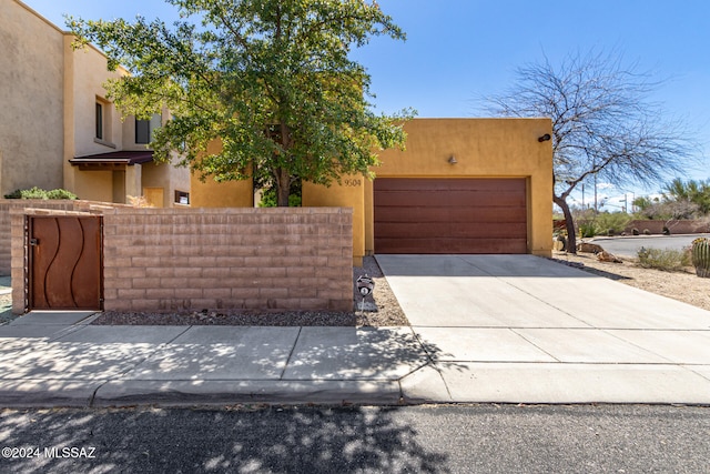 adobe home featuring a garage