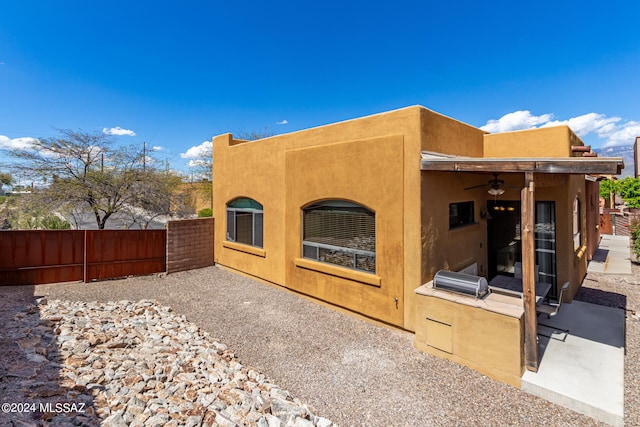 back of house with a patio