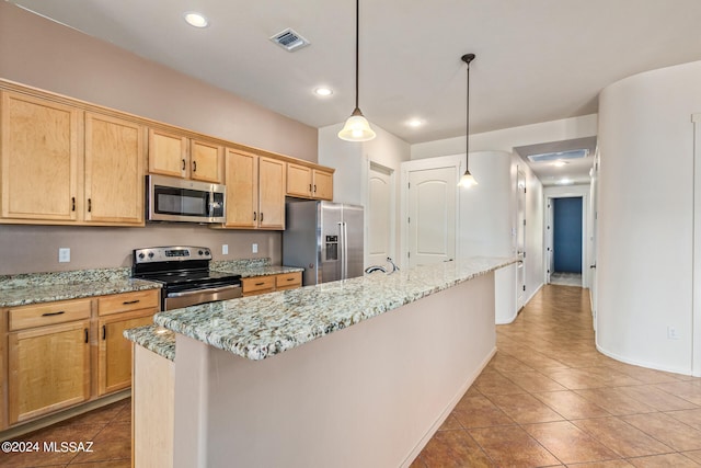 kitchen with light stone counters, light tile patterned floors, an island with sink, and stainless steel appliances