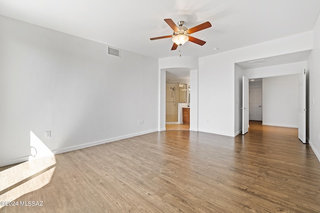 unfurnished room featuring ceiling fan and hardwood / wood-style flooring