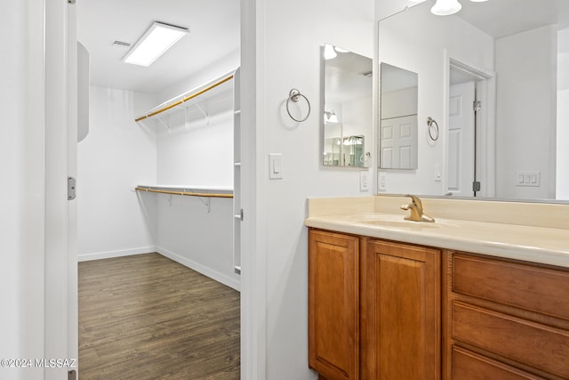 bathroom featuring vanity and hardwood / wood-style flooring