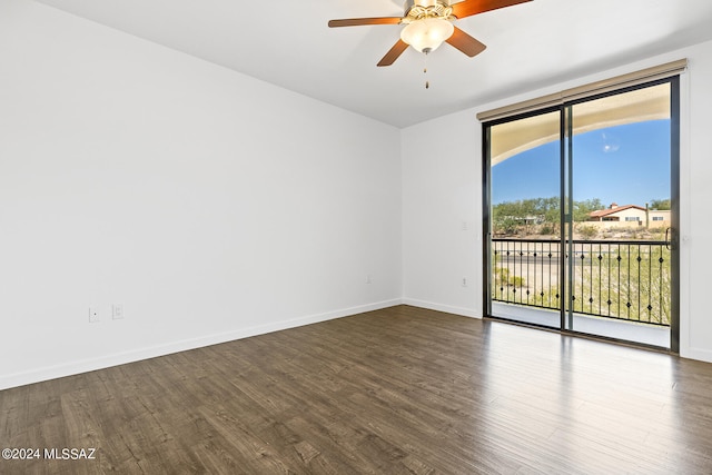 unfurnished room with ceiling fan and dark hardwood / wood-style floors