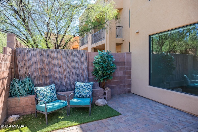 view of patio with a balcony