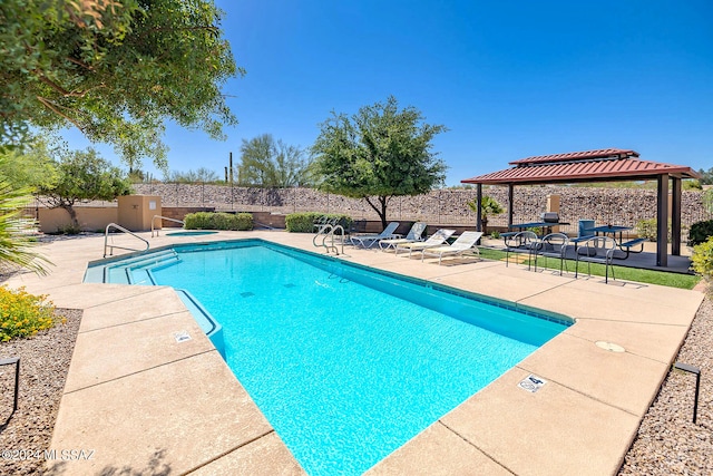 view of swimming pool featuring a gazebo and a patio area