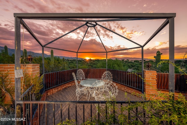 view of patio terrace at dusk