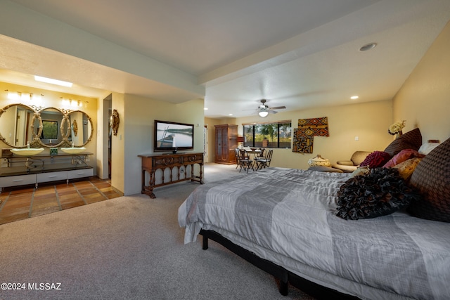 carpeted bedroom with ceiling fan