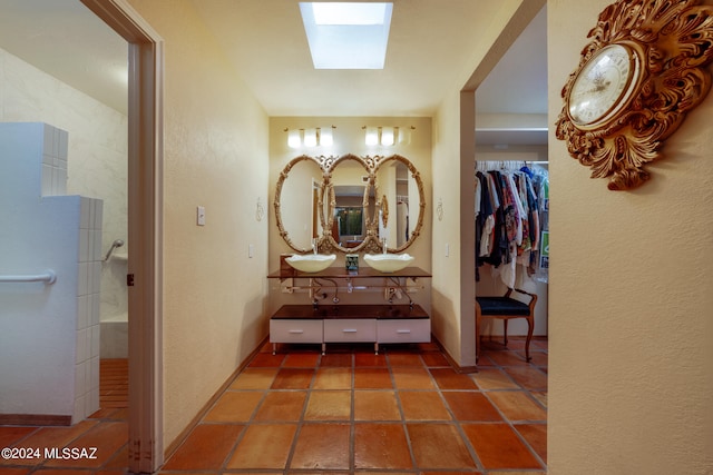 hallway featuring a skylight