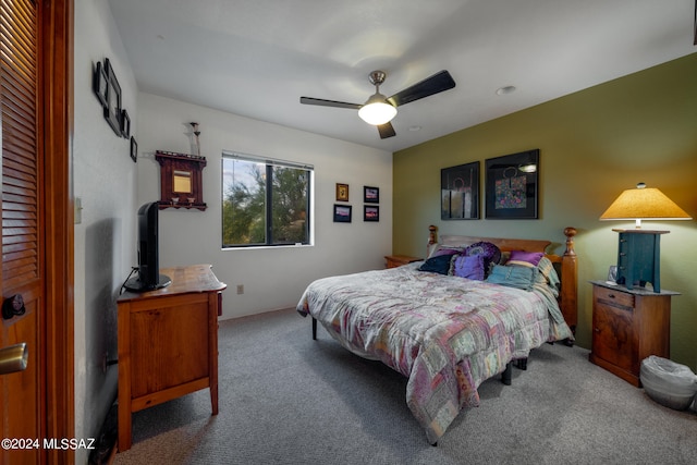 carpeted bedroom with ceiling fan