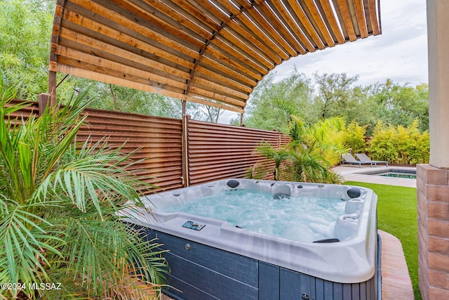 view of patio with a pool with hot tub