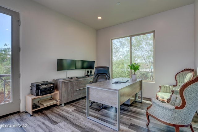 office space featuring recessed lighting, plenty of natural light, and wood finished floors