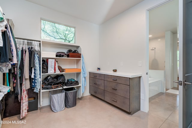 spacious closet featuring light tile patterned floors