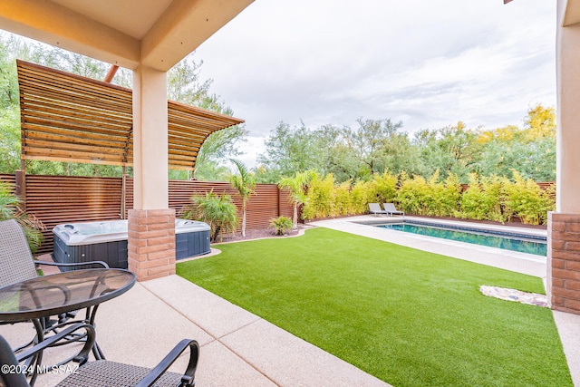 view of yard featuring a patio area, a swimming pool with hot tub, and a pergola