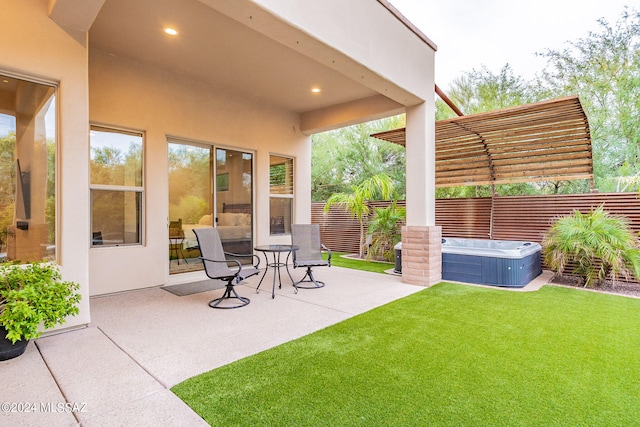 view of patio / terrace featuring a hot tub