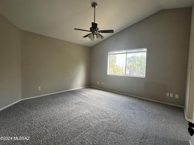 carpeted spare room featuring lofted ceiling and ceiling fan