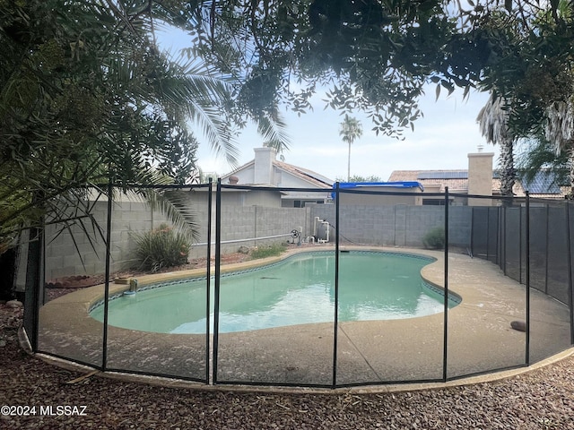 view of pool featuring a fenced in pool and a fenced backyard