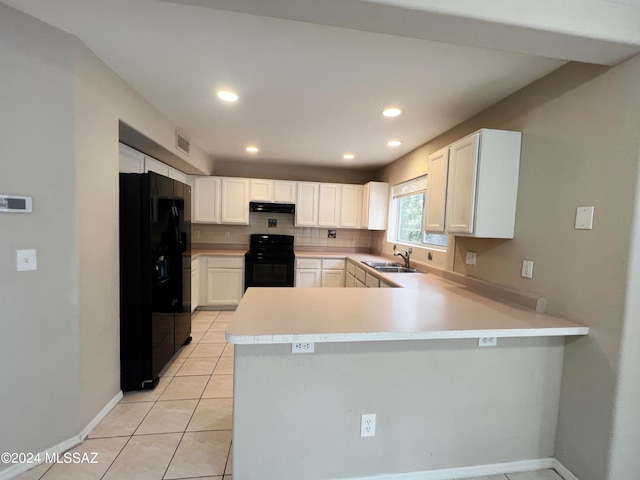 kitchen with white cabinetry, sink, black appliances, kitchen peninsula, and light tile patterned floors