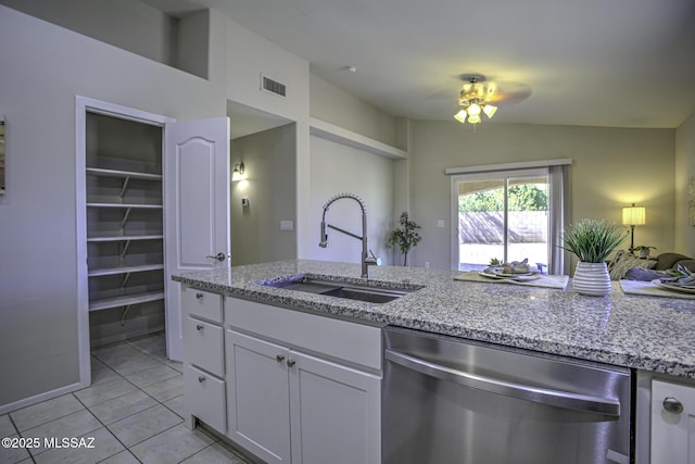 kitchen with dishwasher, a sink, a ceiling fan, white cabinetry, and light stone countertops