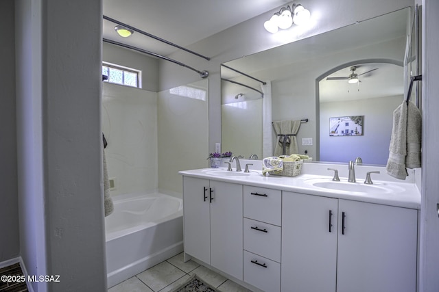 bathroom with tile patterned flooring, shower / bathtub combination, a sink, and ceiling fan