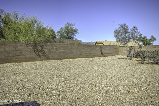 view of yard with a fenced backyard