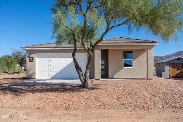 view of front of property with a garage