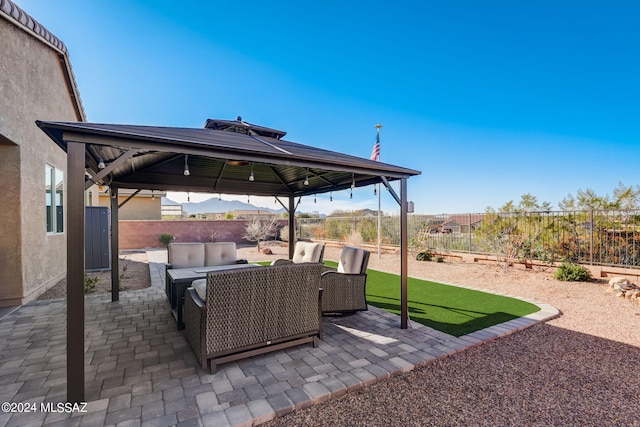 view of patio with a gazebo and outdoor lounge area