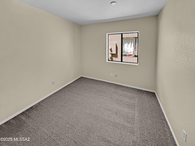 unfurnished room with carpet floors