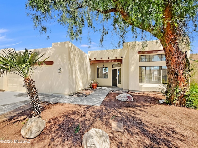 rear view of house with a garage