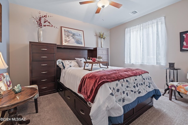 bedroom with light carpet, baseboards, visible vents, and a ceiling fan