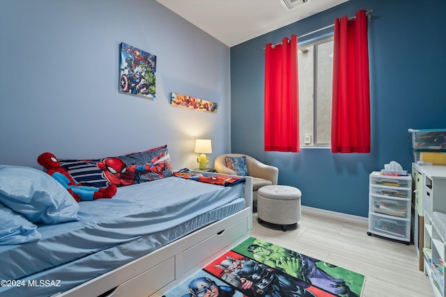 bedroom featuring visible vents and baseboards