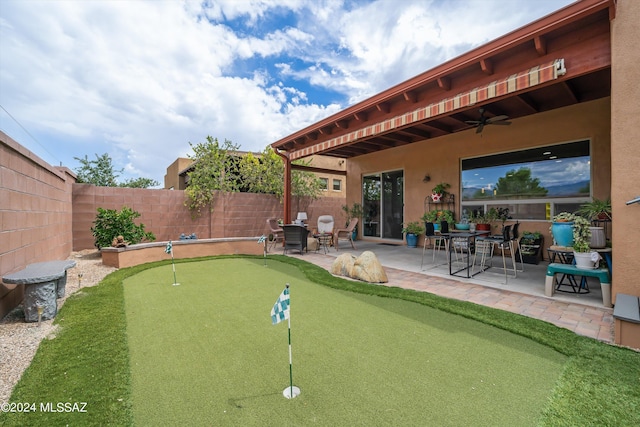 exterior space with a ceiling fan, a fenced backyard, and a patio