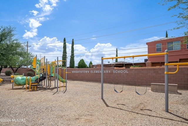 communal playground featuring fence