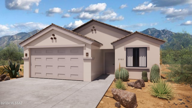 view of front facade with a garage and a mountain view