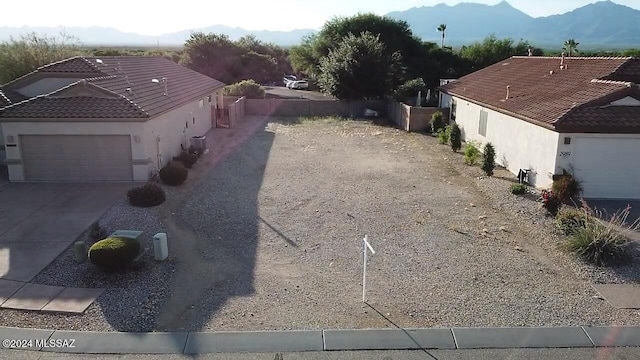 exterior space featuring a garage and a mountain view