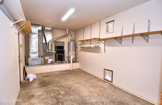 utility room featuring gas water heater