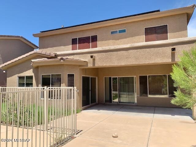 back of house with a patio