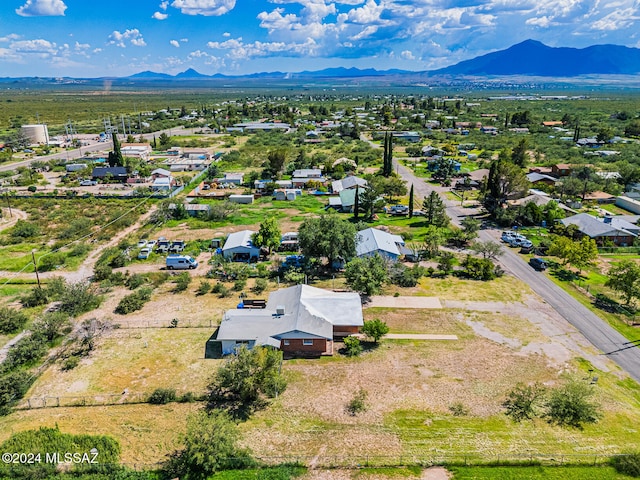 birds eye view of property with a mountain view