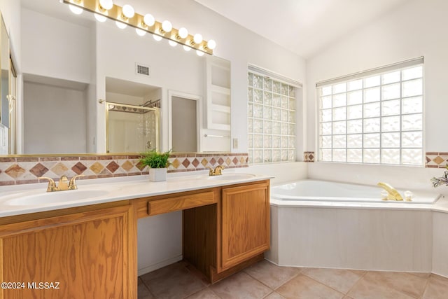 full bathroom featuring tile patterned flooring, vaulted ceiling, a sink, visible vents, and double vanity
