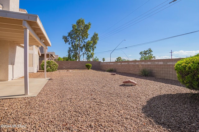view of yard featuring a fenced backyard and a patio area