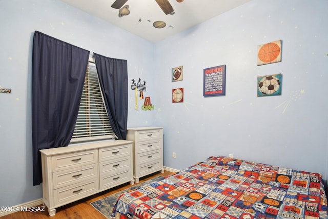 bedroom featuring ceiling fan and hardwood / wood-style flooring