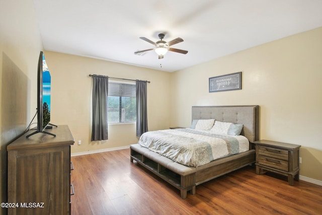 bedroom with hardwood / wood-style floors and ceiling fan