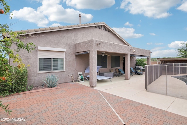 back of property with a patio area